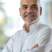 handsome-hispanic-senior-business-man-with-crossed-arms-smiling-aside-indian-lati-generative-ai (1)